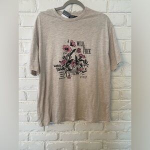 NWT oversized tee runs VERY BIG comfy 
Oatmeal color wild and free flower shirt